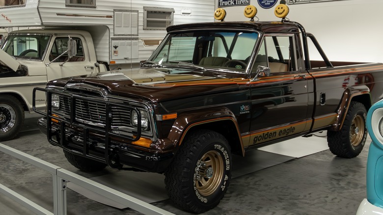 A Jeep J10 truck parked in a parking garage