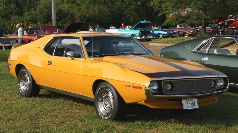 Orange 1971 AMC Javelin AMX parked on grass