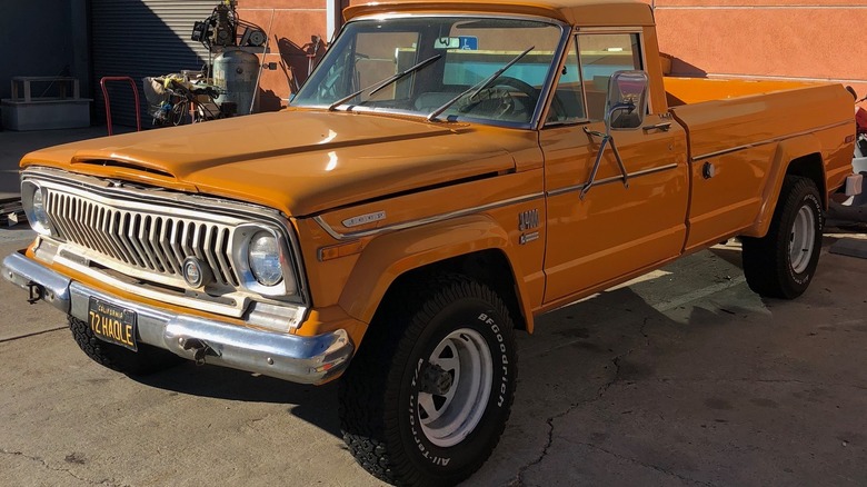 Orange Jeep J-10 parked