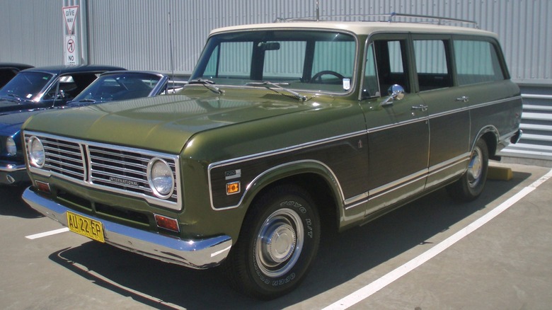 Green 1973 International Harvester Travelall parked