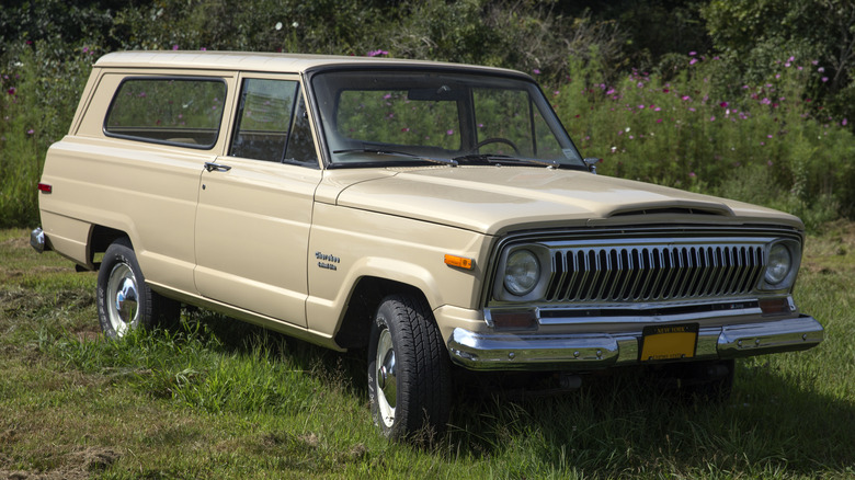 Beige 1975 Jeep Cherokee parked on grass