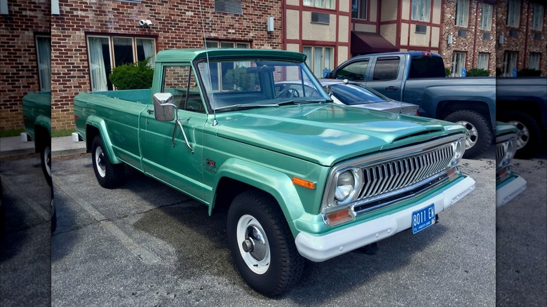 Green 1974 Jeep J-10 parked on tarmac