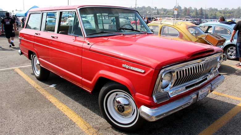 Red 1976 Jeep Wagoneer on display