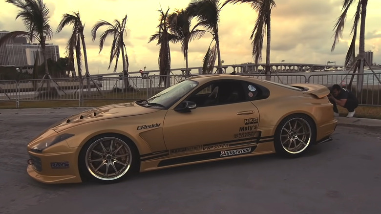 Top Secret Toyota Supra in gold color side profile