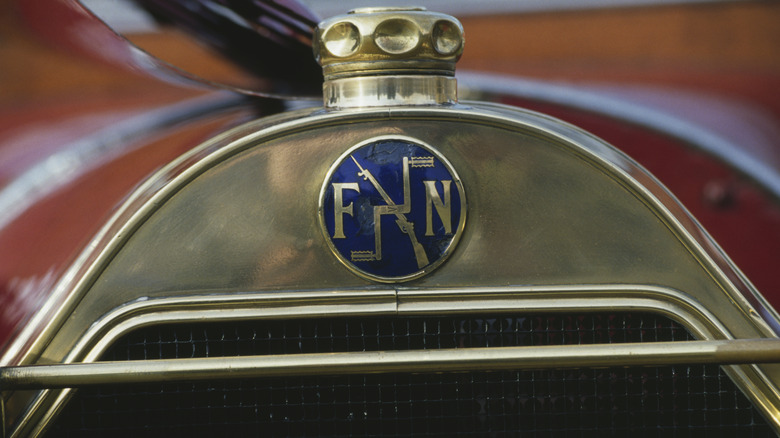 A FN Four Pedal And Firearm Emblem