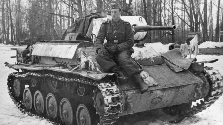 German soldier sitting on captured T-70