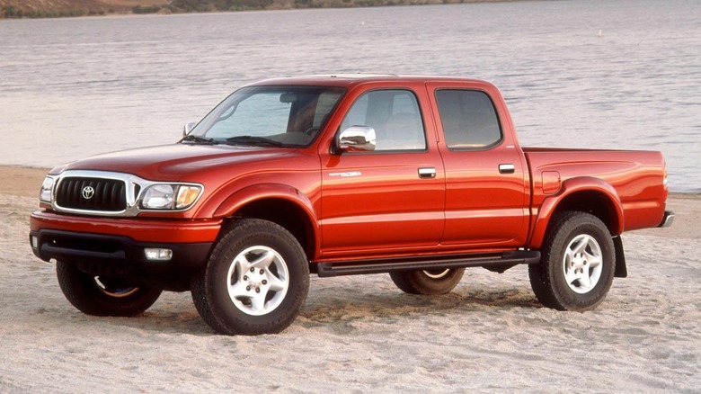 Red 2002-2004 first generation Toyota Tacoma in desert