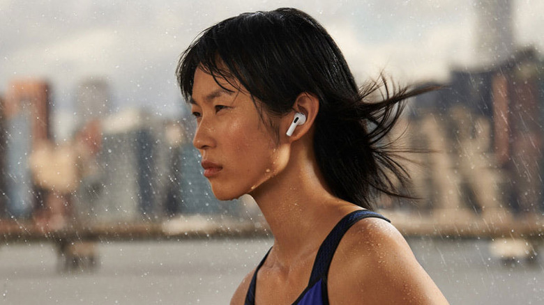 person with AirPods running rain