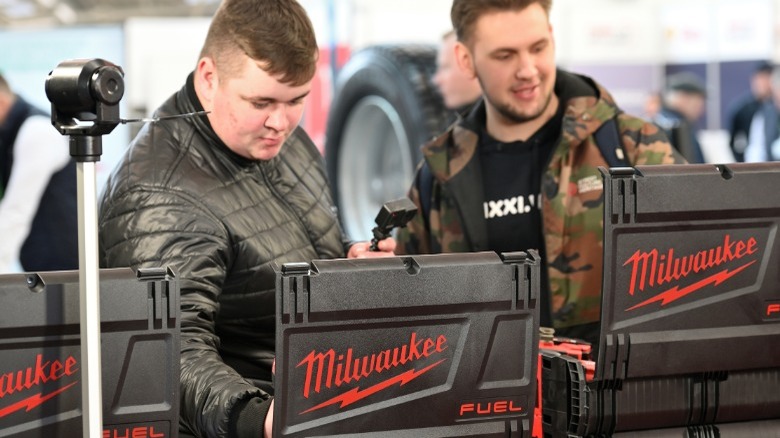 people shopping for milwaukee tools