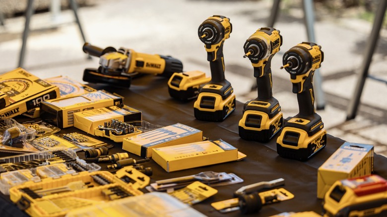 A yellow DeWalt tool positioned on a wall