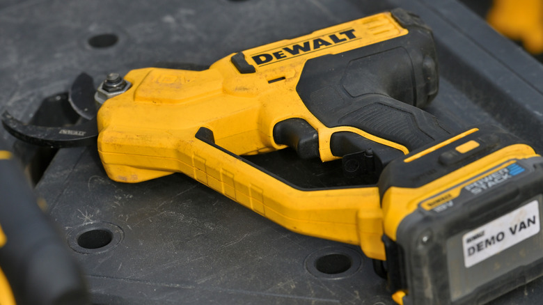 A yellow and black DeWalt tool on its side