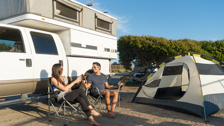 family with camper truck