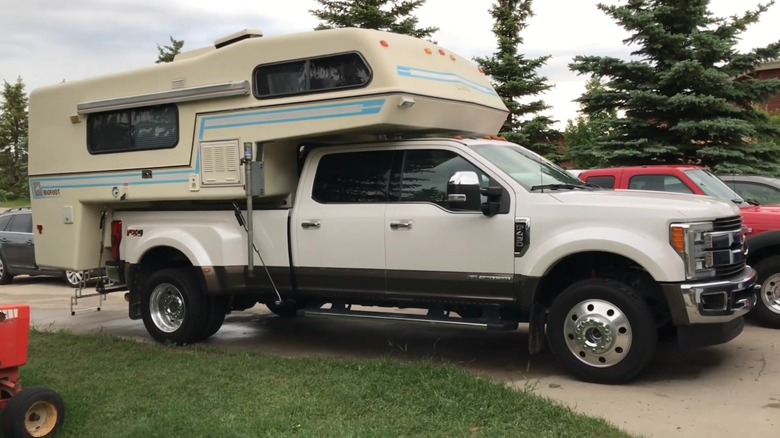 Ford F450 dually with Bigfoot truck camper