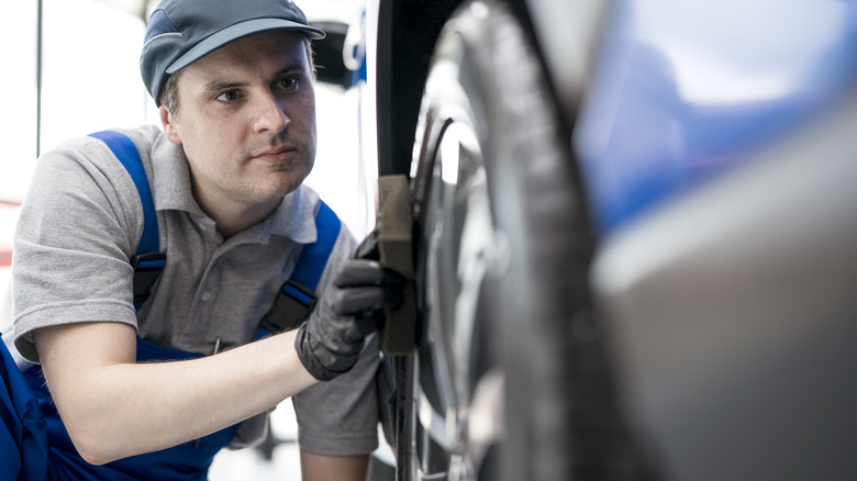 Man applying tire shine