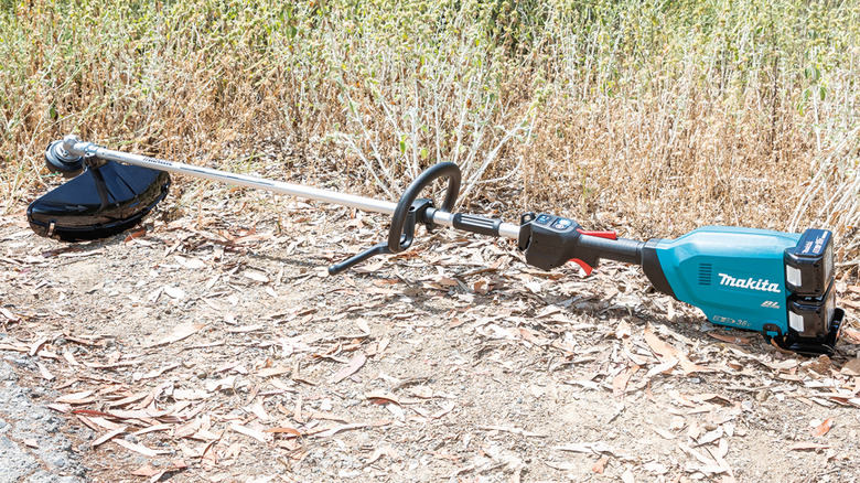 String trimmer set on the ground