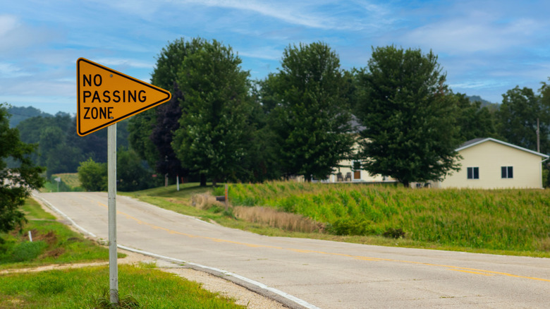 No Passing Zone sign on the side of a roadway