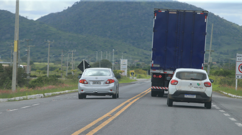 Car passing a truck in a no-passing zone