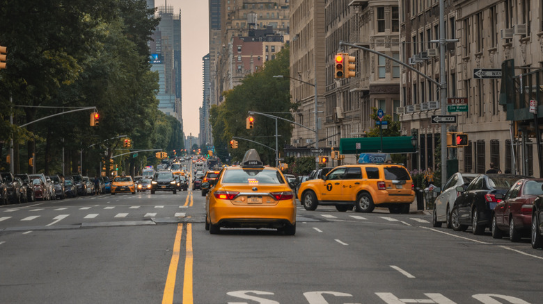 City road with cars and double solid yellow line marking