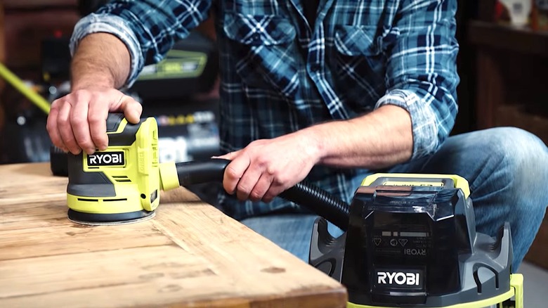 Orbit Sander hooked to shop-vac