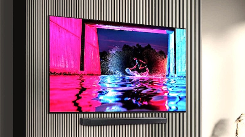 A large-screen Samsung TV hangs on a wall