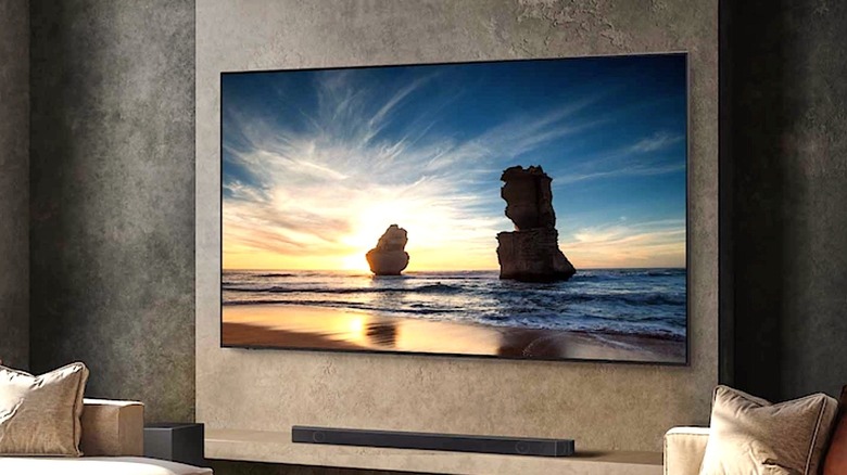 A large-screen Samsung TV hangs on a wall