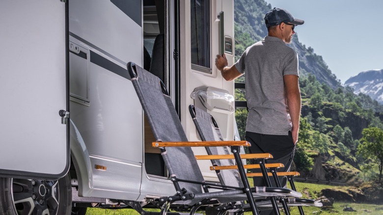 Owner of an RV in front of the vehicle