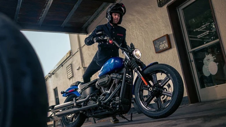 Man getting on Street Bob 114