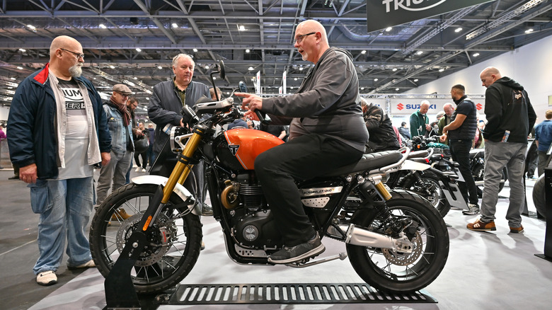 Person on 2024 Triumph at show