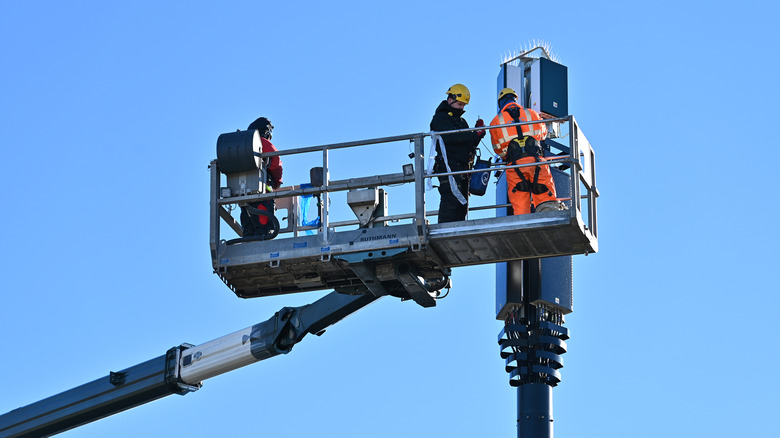 Men working on cell tower