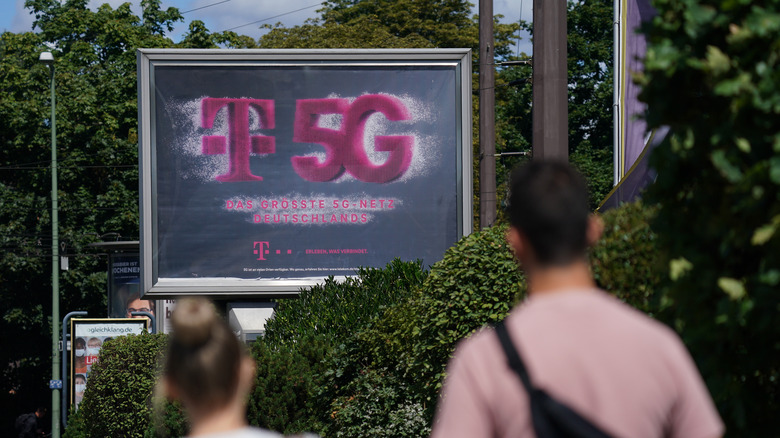 5G billboard ad with people