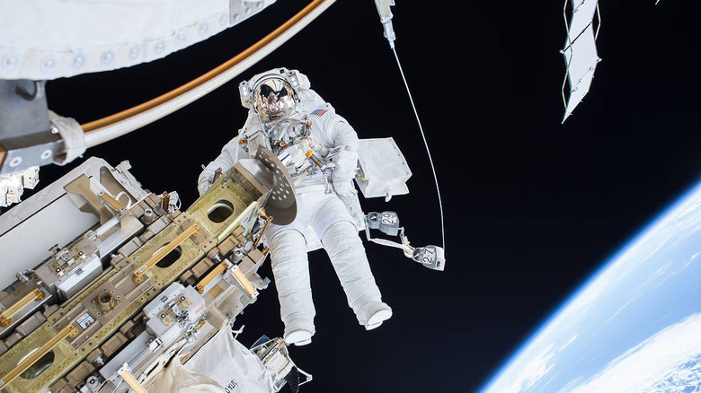 Astronaut performs spacewalk