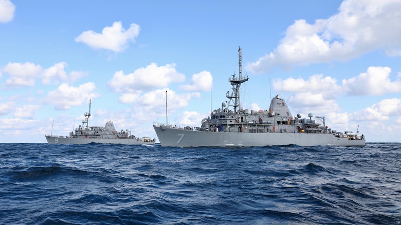 Two navy minesweepers on the ocean