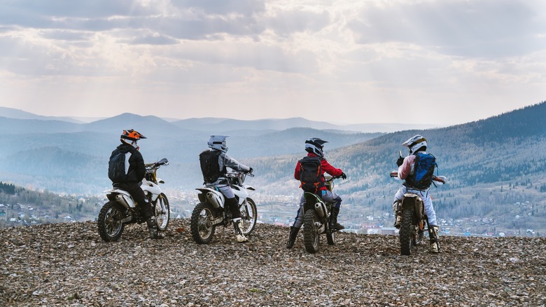 group of motor riders offroad