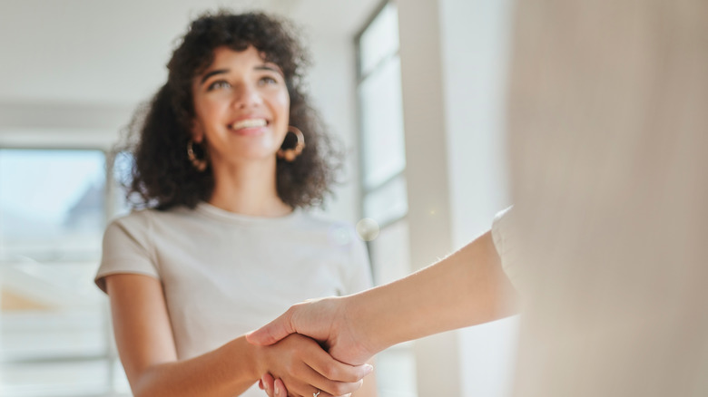 woman shaking hands