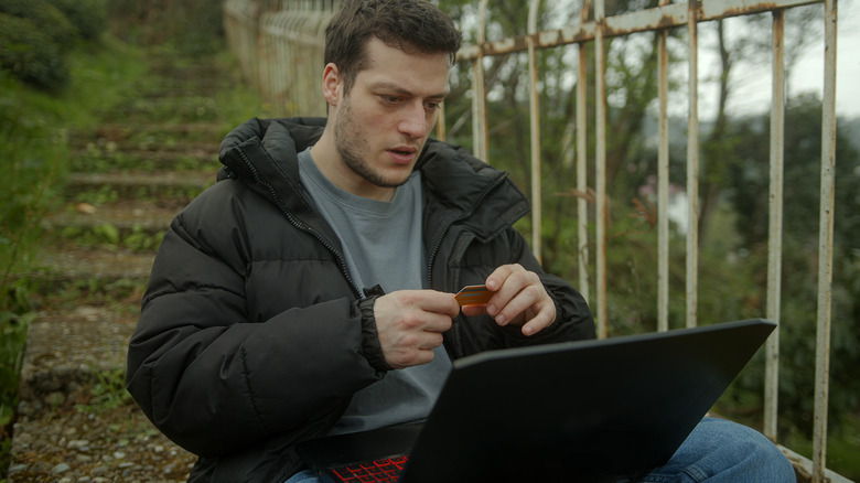 Man on laptop realizing he was scammed