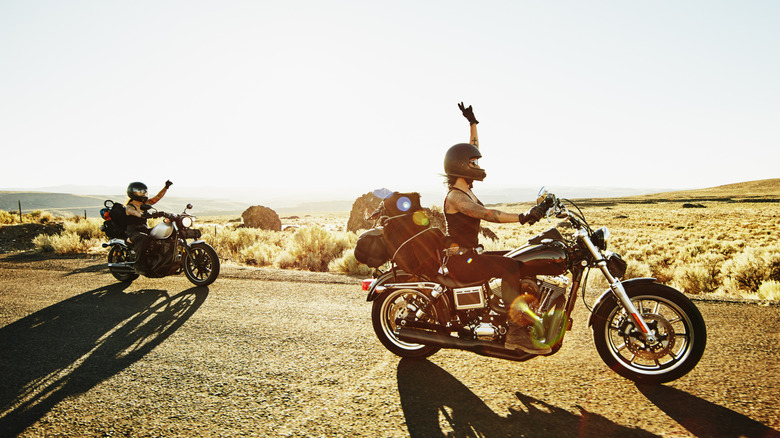 Two motorcycles on an open desert road