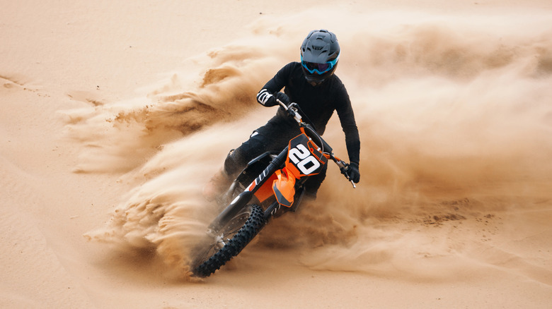 Person riding through desert