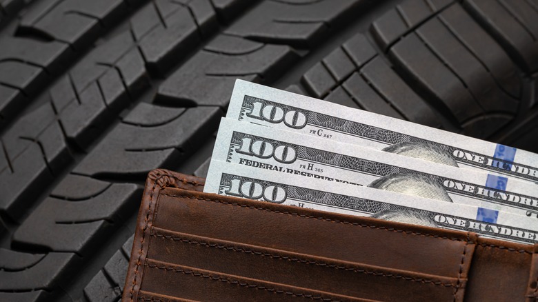 A car tire with money