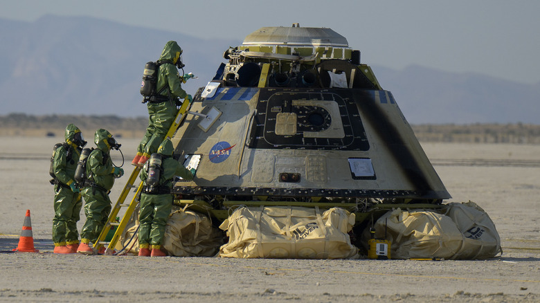 NASA staff inspecting the Boeing Starliner