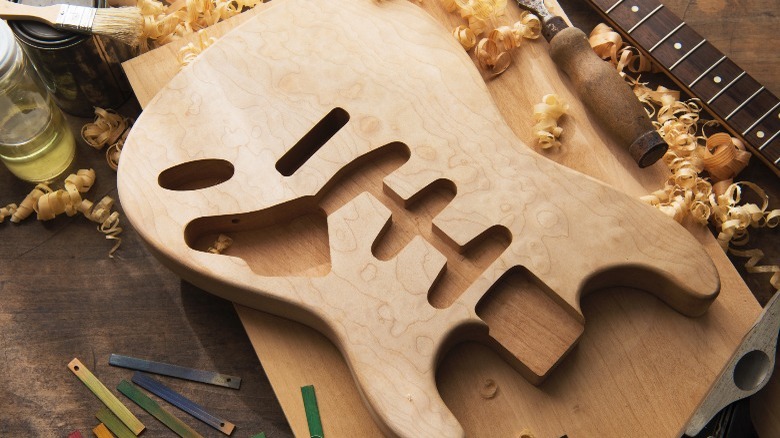 Picture of an unfinished solid-body guitar panel.