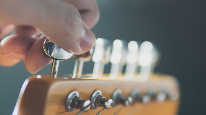 Close-up picture of a Fender electric guitar stock tuners.