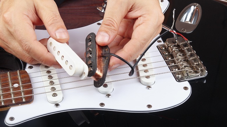 Picture of working on single-coil electric guitar pickups.