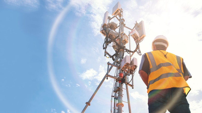 Engineer working on a 5G tower 