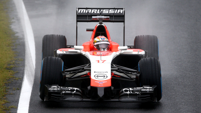 Jules Bianchi driving No. 17 Marussia F1 car in rain at 2014 Japanese Grand Prix