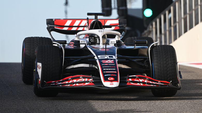 Oliver Bearman's No. 50 Haas car parked on track with rain tires