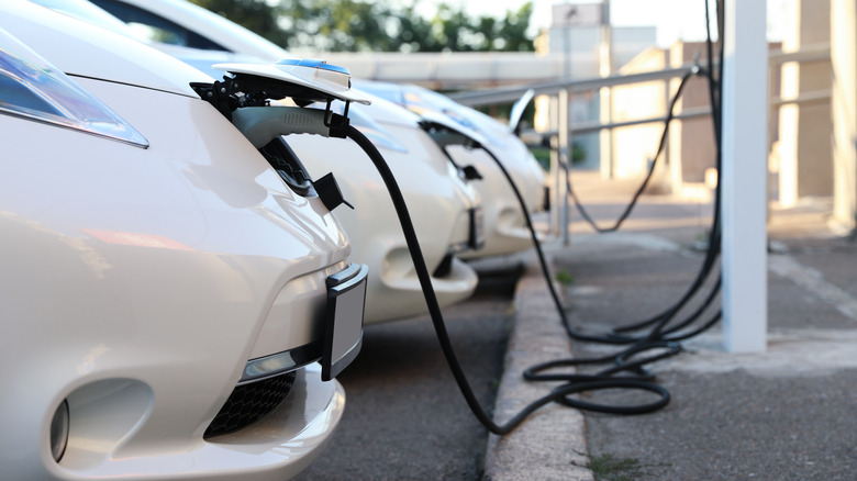 Electric cars charging at a station