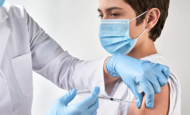 Boy getting vaccine shot