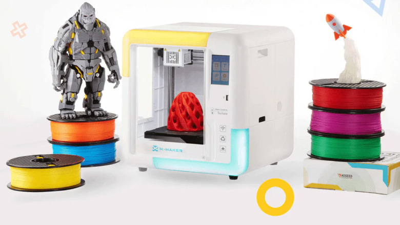 AOSEED X-Maker with several printed toys and filaments