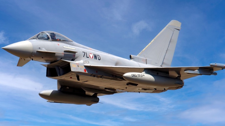 Eurofighter Typhoon flying over clouds