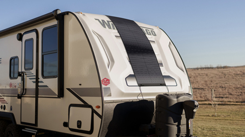 Flexible solar panel hanging from RV